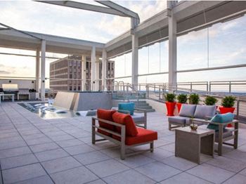 One-of-a-kind above deck pool featuring in-water lounge areas and additional sundeck seating