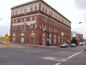 Shreveport apartment for rent - A brick building with a sign that says "LIVE/WORK SPACE" on it.