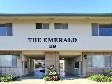 Mountain View apartment for rent - the emerald apartment building with a sign on the front of it