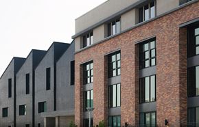 West Sacramento apartment for rent - a row of brick apartment buildings with large windows