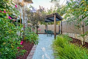 Sunnyvale apartment for rent - a patio with a table and chairs in a backyard