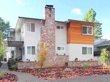 Palo Alto apartment for rent - a white house with a brick wall in front of it