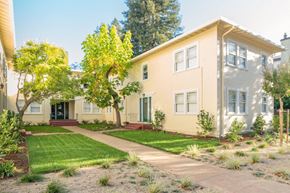 Palo Alto apartment for rent - a house with a sidewalk and lawn in front of it