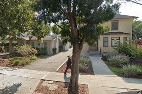 Palo Alto apartment for rent - a person walking down a sidewalk next to a tree