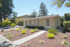 Palo Alto apartment for rent - a small tan house with a garden in front of it