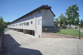 Palo Alto apartment for rent - the side of a building with a street and a sidewalk