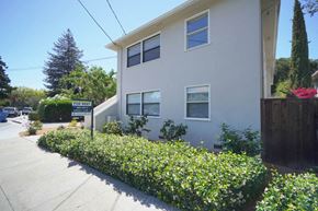 Palo Alto apartment for rent - a white house with a garden in front of it
