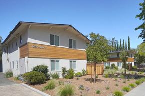 Palo Alto apartment for rent - a white house with a wooden fence in front of it