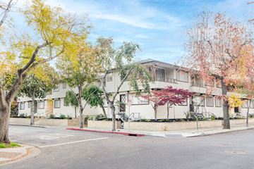 Palo Alto apartment for rent - an apartment building on the corner of a street with trees
