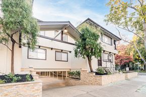 Palo Alto apartment for rent - a house with a sidewalk and trees in front of it