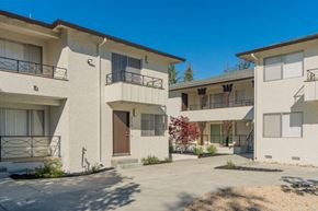 Palo Alto apartment for rent - a group of apartments with balconies and a sidewalk