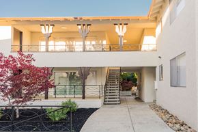 Palo Alto apartment for rent - a building with a staircase and a balcony
