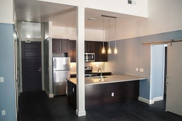 Pittsburgh apartment for rent - a view of a kitchen with a sink and a refrigerator