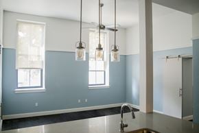Pittsburgh apartment for rent - a kitchen with blue and white walls and a sink