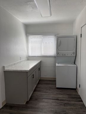 Modesto house for rent - A small, white medical room with a cabinet and a monitor.