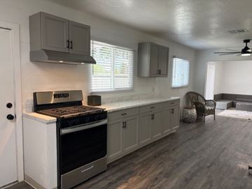 Modesto apartment for rent - A kitchen with a stove and cabinets.