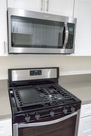 Pasadena apartment for rent - a kitchen stove with a microwave above it