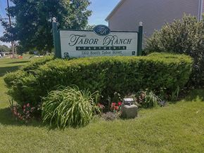 North Platte apartment for rent - a sign is in the front of a garden