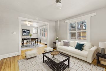 Denver apartment for rent - a living room with a couch and a table