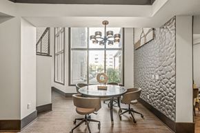 Charlotte apartment for rent - a dining room with a table and chairs and a large window
