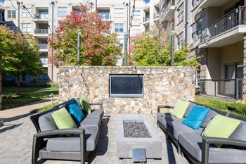 Pool-side fire pit with soft seating