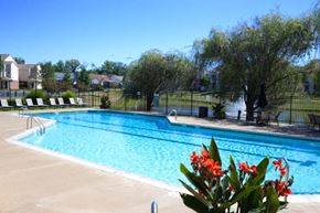 Indianapolis apartment for rent - a large swimming pool in a backyard with flowers