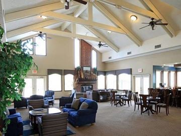 Fishers apartment for rent - a large living room with couches and chairs and a table