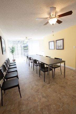 San Mateo apartment for rent - a large dining room with a large table and chairs and a ceiling fan