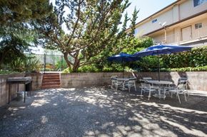 San Mateo apartment for rent - a patio with a table and chairs and umbrellas
