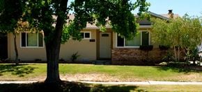 San Jose house for rent - A house with a tree in front of it.