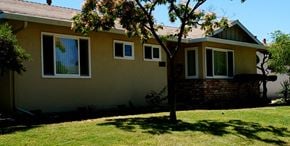 San Jose house for rent - A house with a tree in front of it.