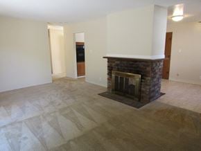 San Jose house for rent - A living room with a fireplace and a television.