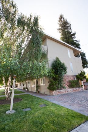 San Jose apartment for rent - the side of a house with a yard and a sidewalk