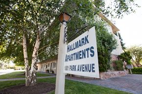 San Jose apartment for rent - a sign for hillmark apartments in front of a tree