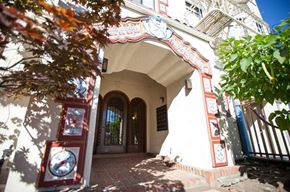 Burlingame apartment for rent - a white building with a door and a tree