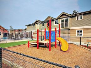 Federal Way apartment for rent - a playground with a blue and yellow swing set