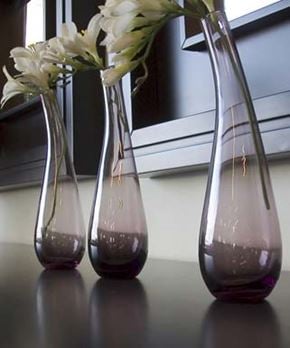 Bellingham apartment for rent - Three vases with flowers in them are sitting on a table.