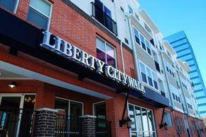 Salt Lake City apartment for rent - a building with a sign that reads liberty citywalk