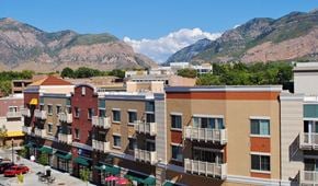 Ogden townhouse for rent - an aerial view of a city with mountains in the background