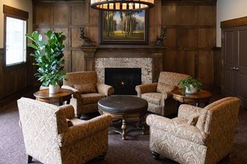 Ogden townhouse for rent - A living room with a fireplace and a painting on the wall.