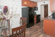 New Hope apartment for rent - a kitchen with black appliances and a table and chairs