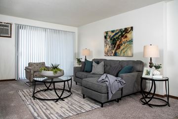 Plymouth apartment for rent - a living room with a couch and a table