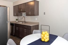 West Saint Paul apartment for rent - a kitchen and dining room with a bowl of lemons on the table
