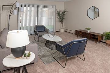 West Saint Paul apartment for rent - a living room with couches and chairs and a table
