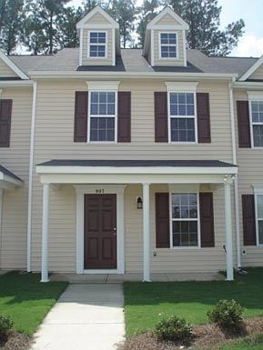 Knightdale townhouse for rent - a house with a sidewalk in front of it