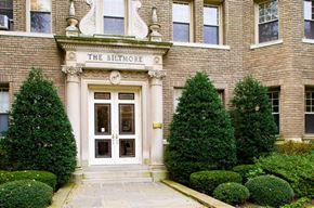 Washington apartment for rent - a large brick building with a white door