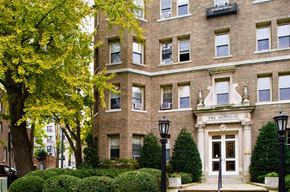 Washington apartment for rent - a large brick building with a tree in front of it