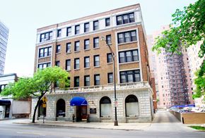 Chicago apartment for rent - a brick building on the corner of a city street