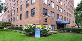 Evanston apartment for rent - a large brick building with a sign in front of it
