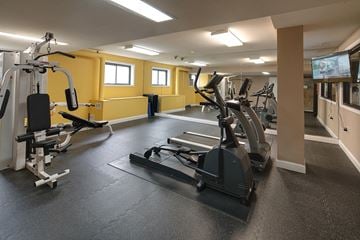 Evanston apartment for rent - a gym with exercise equipment and a tv